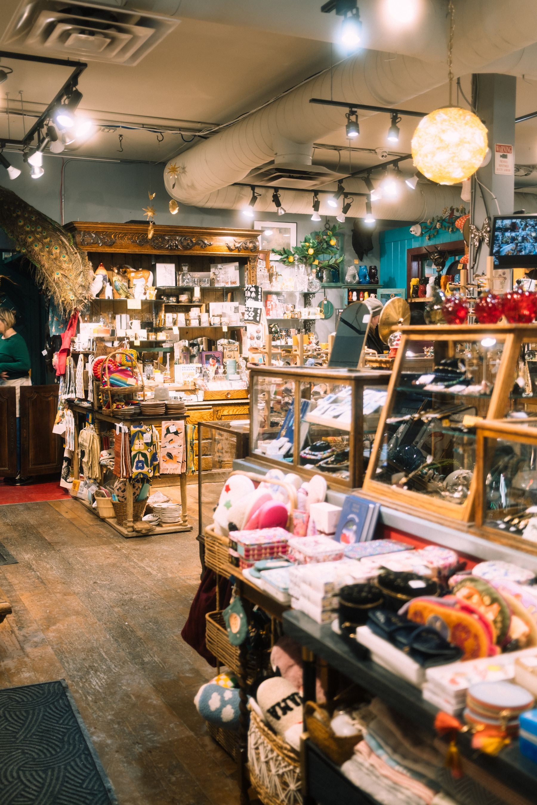 Shopkeeper arranging products on shelves