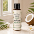 Fresh Coconut Hydrating Body Lotion bottle, 3.4 fl oz, styled with coconut and tropical leaves