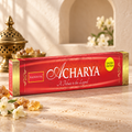 Nandita Acharya Limited Edition 15g incense on a warm ivory stone surface with botanical accents