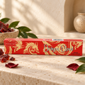 Nandita Dragon Blood 15g incense on a warm ivory stone surface with red resin